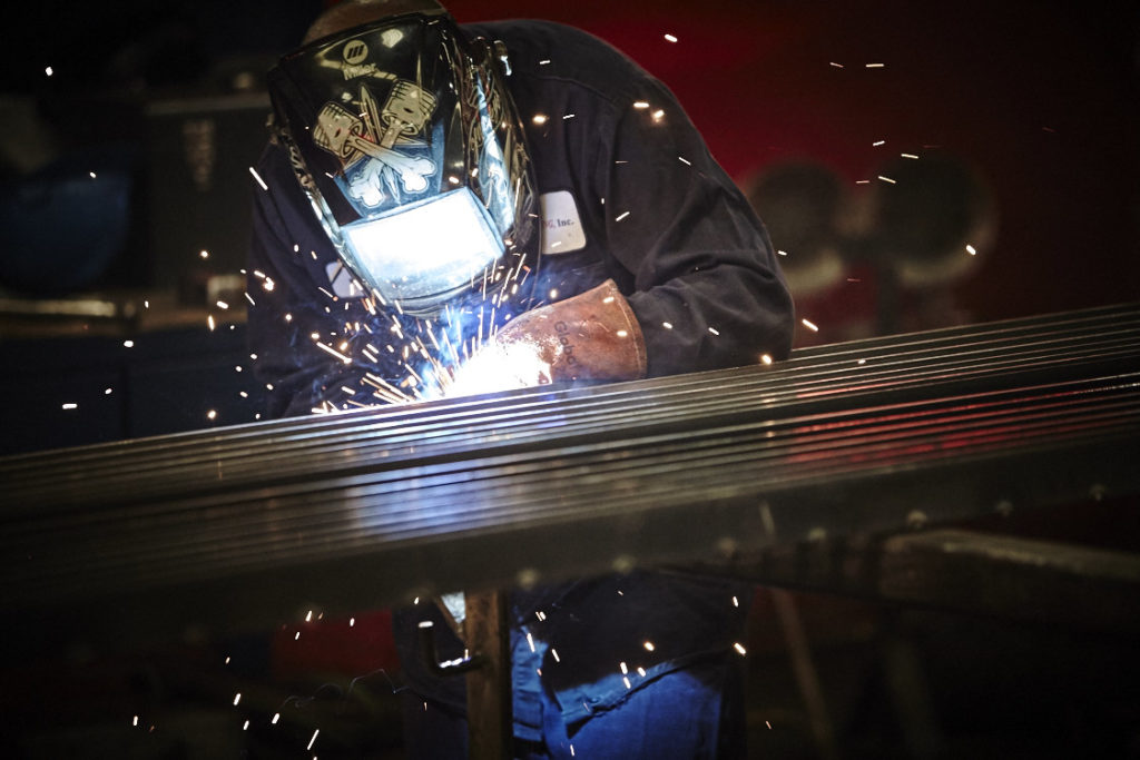 man welding with sparks