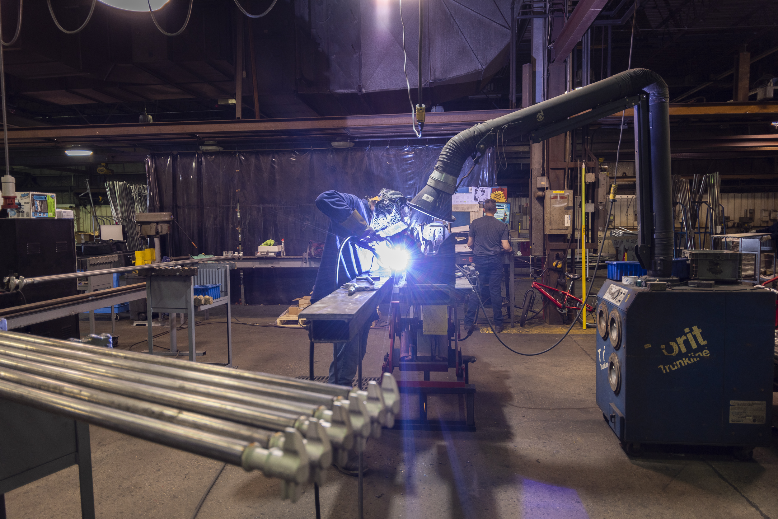 man welding a lockrod