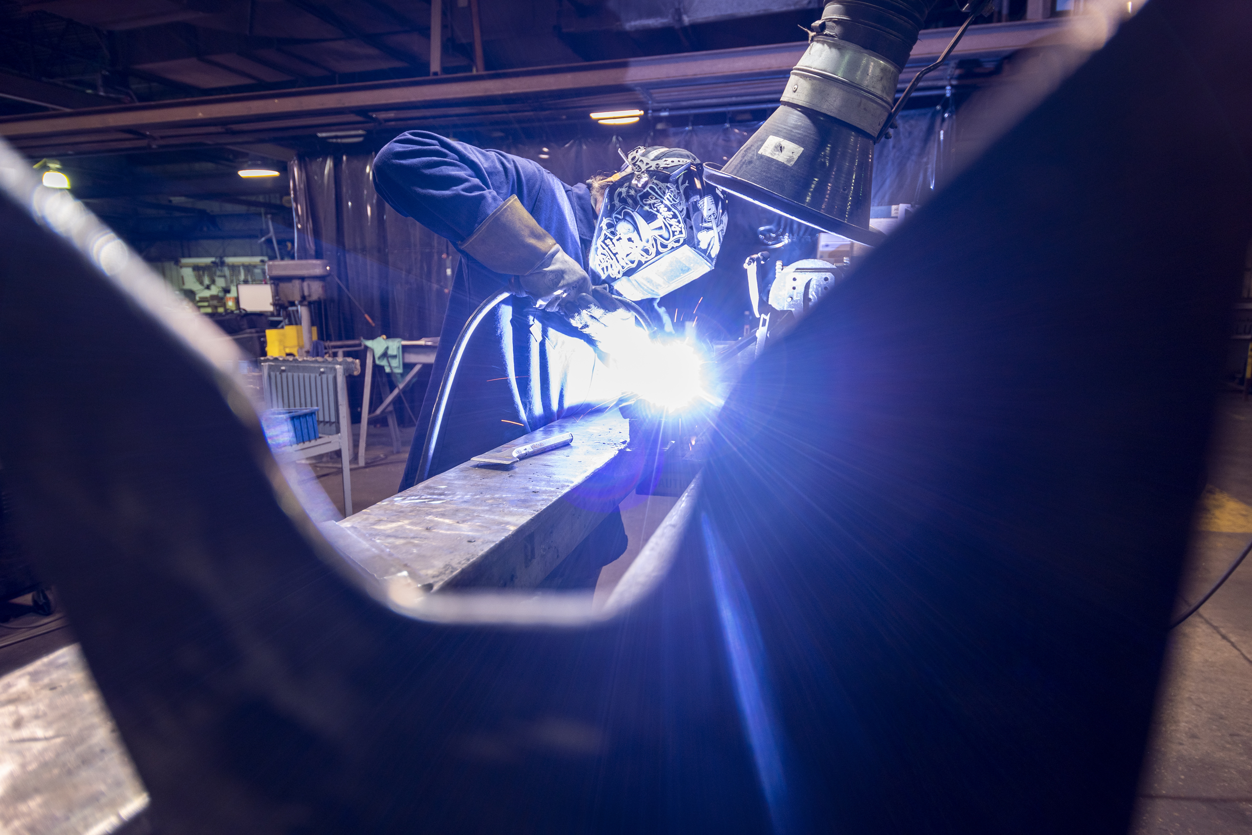 man welding a lockrod