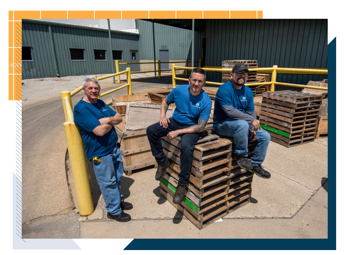 3 employees outside the shop