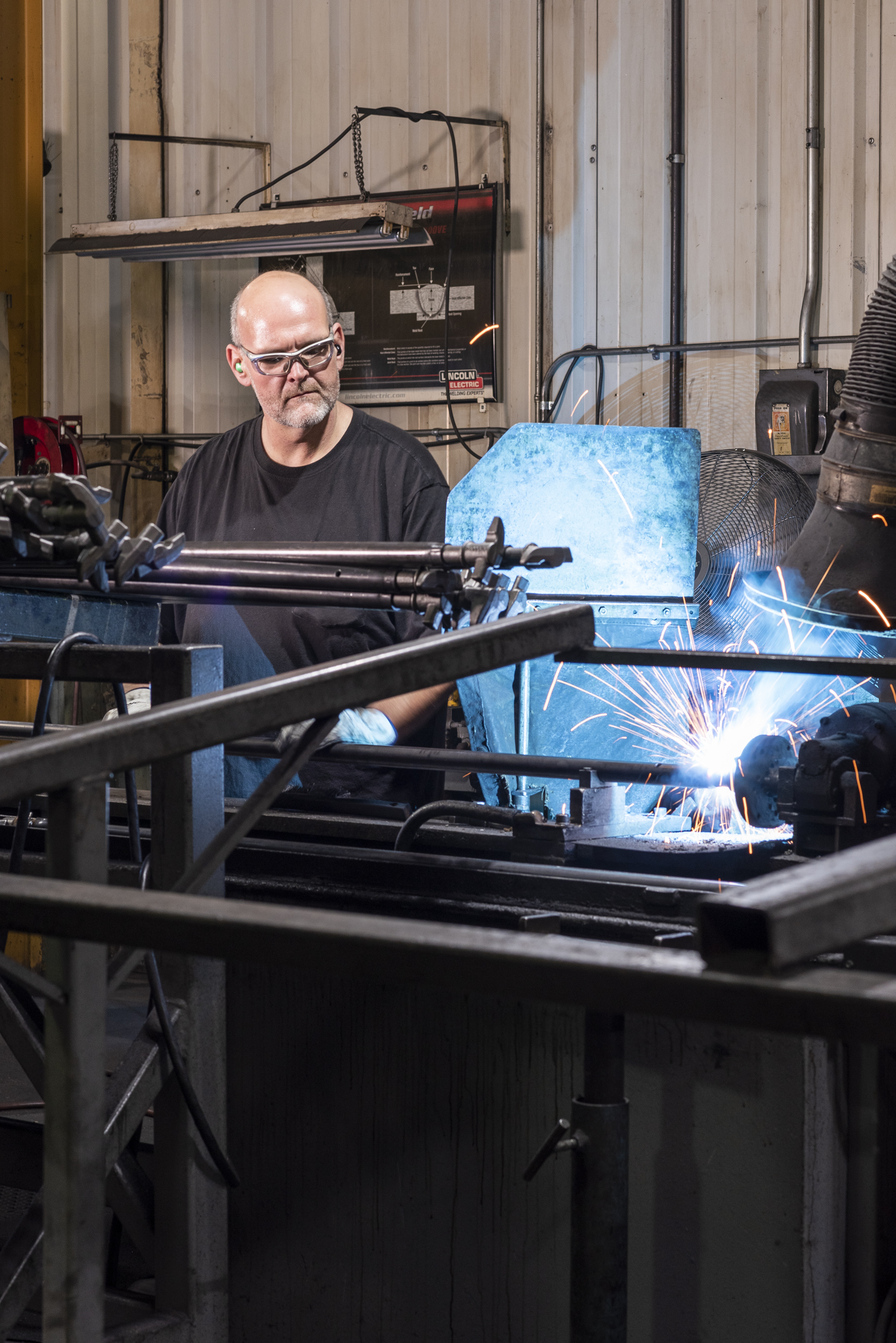 man welding a lockrod